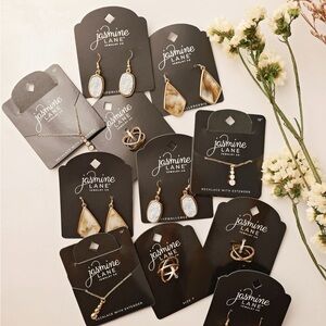 wholesale lot 150 pieces includes necklace, 2 pair of earrings and ring size 7.